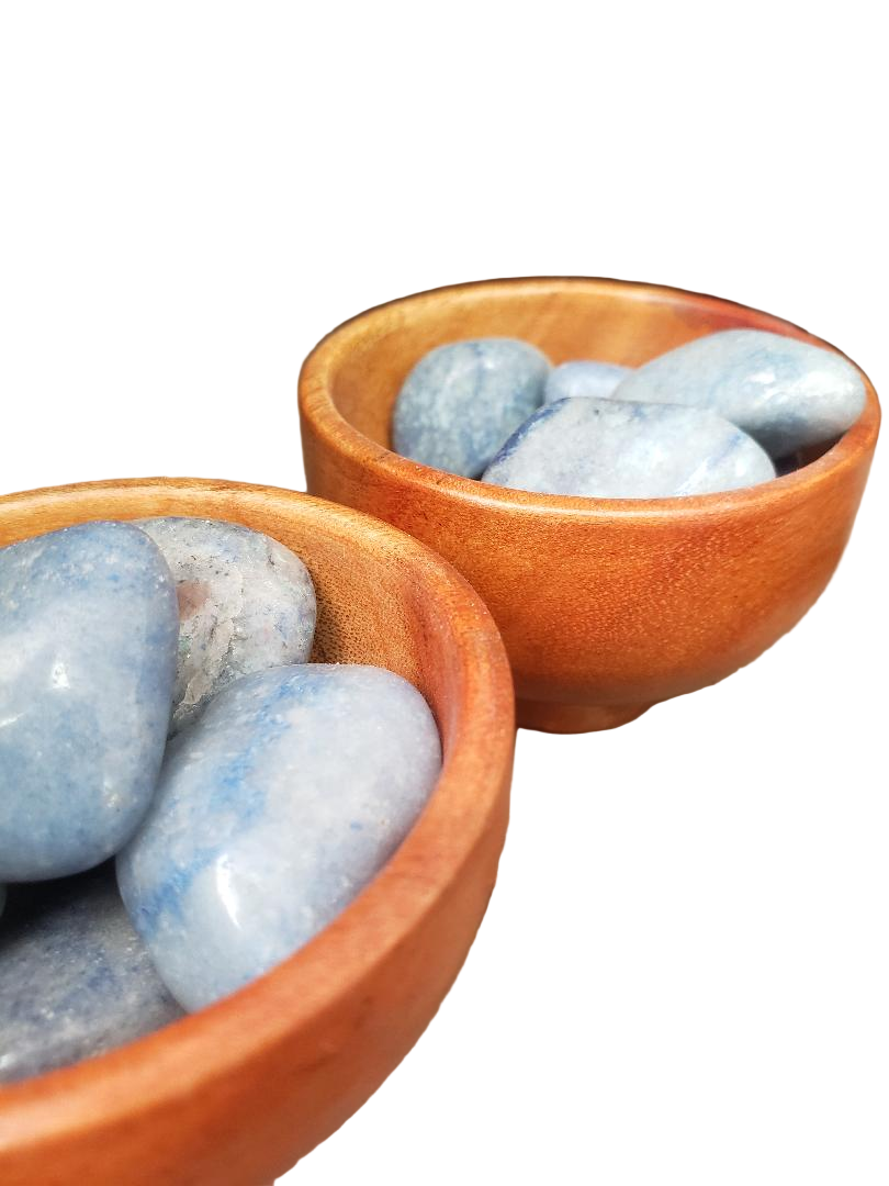 Two wooden bowls filled with blue stones on a white background