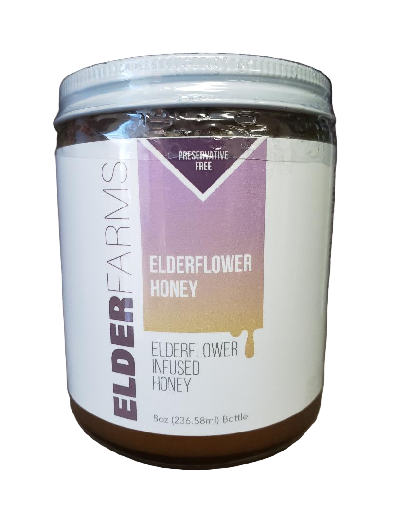 Jar of Elderflower Honey with a white label on a white background