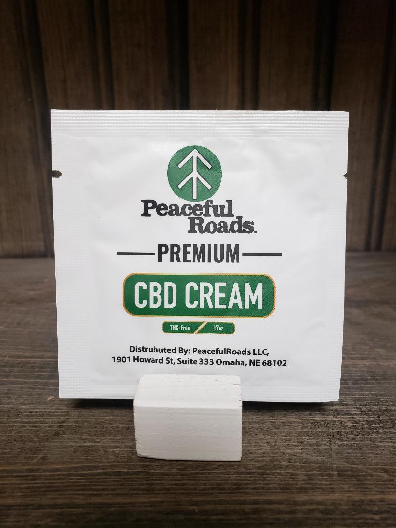 Peaceful Roads CBD Cream on a rustic background