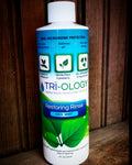 Bottle of Triology Restoring Rinse with cool mint flavor, highlighting its microbiome-protective properties and organic ingredients.